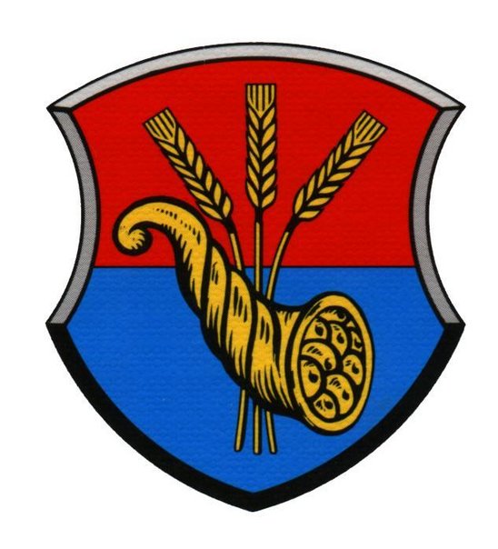 Wappen von Krugzell: Schild unten blau oben rot mit Füllhorn und Ähren in Gold
